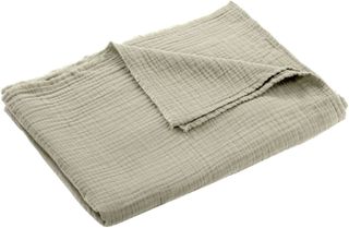A sage green woven blanket