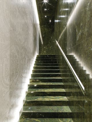 Brazilian turtle green marble covers walls and staircases