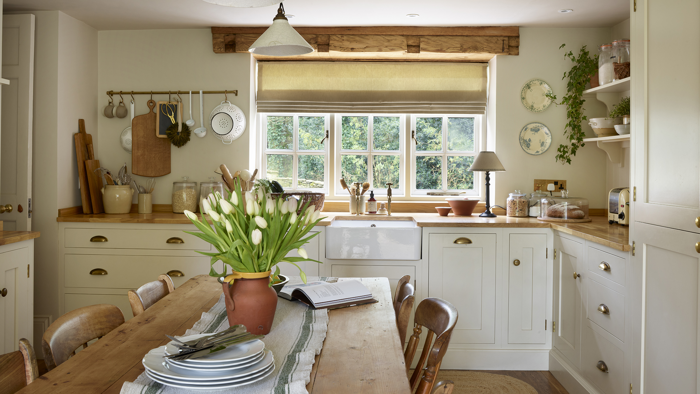cream shaker country kitchen with table in the centre