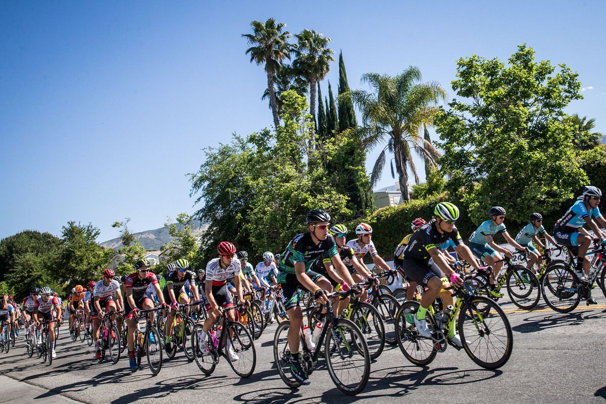 The men leave the start for stage 2