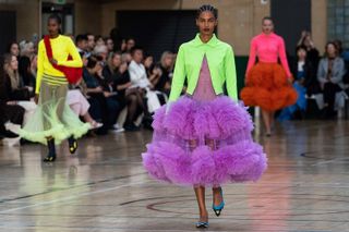 Models present creations by Molly Goddard during the Spring/Summer 2023 catwalk show on the third day of London Fashion Week June Edition, in London, on September 17, 2022