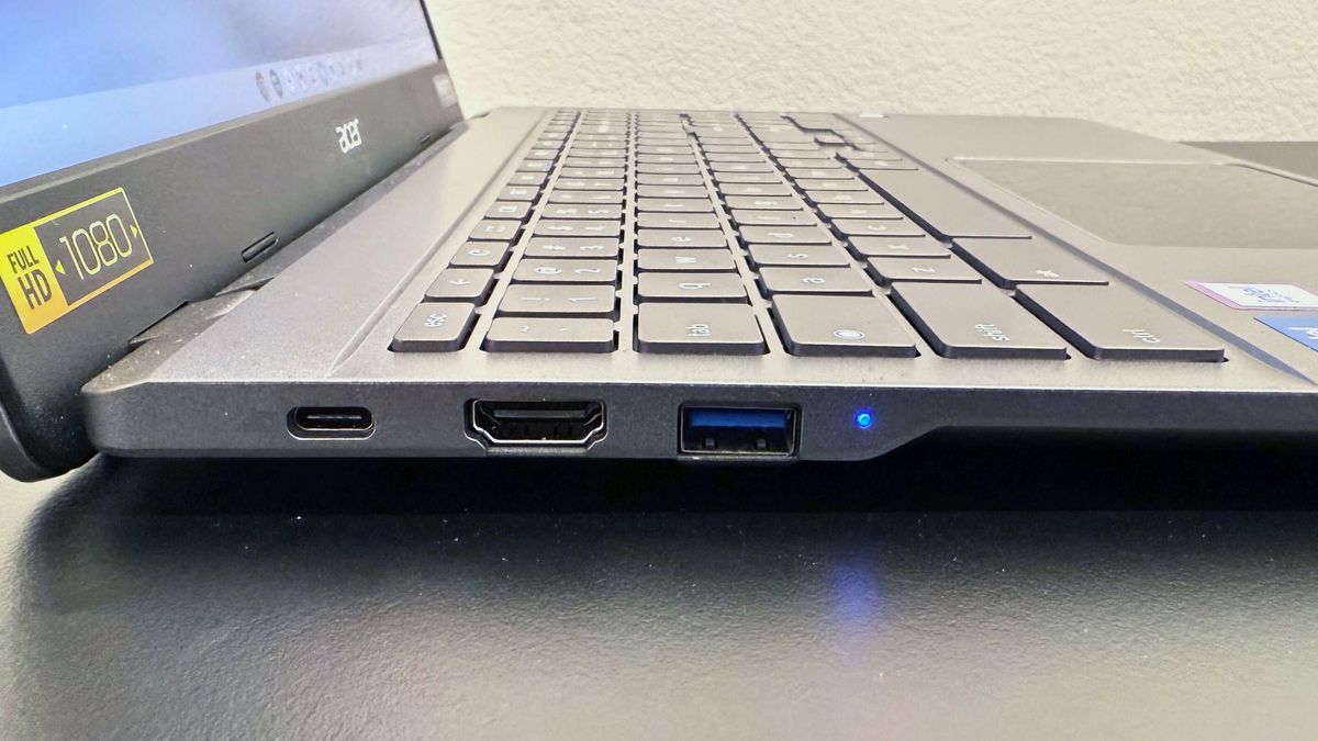 Close up of the right-side ports on the Acer Chromebook Plus Enterprise 515, on a black desk against a white background.