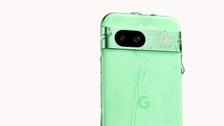 Google Pixel 8a in Aloe covered in water droplets