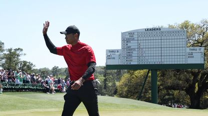 Tiger Woods waves to the crowd at The Masters