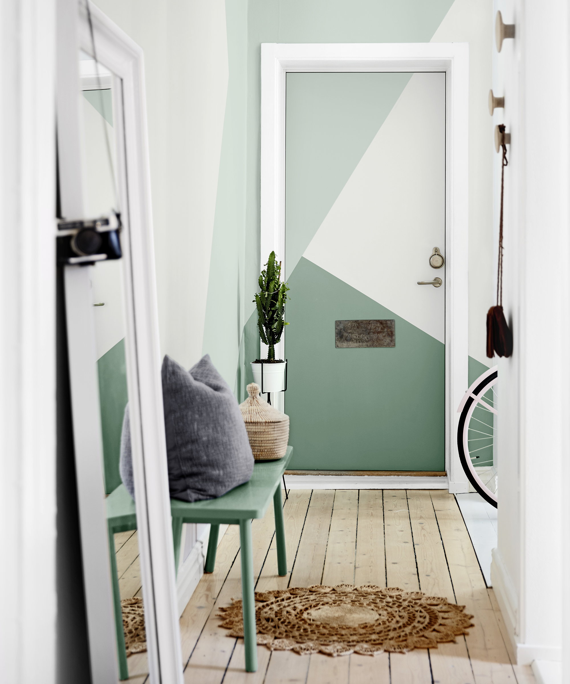 Hallway ideas by Dulux using Chiffon White paint, Highland Falls 2 and Highland Falls 4 green paint shades with floor length mirror, bicycle and jute doormat