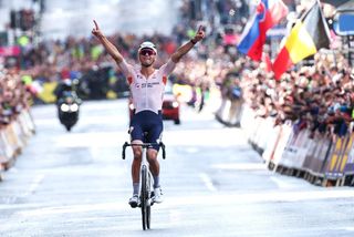 Mathieu van der Poel (Netherlands) celebrates as he crosses the finish line to win the elite men’s road race at the UCI World Road Championships