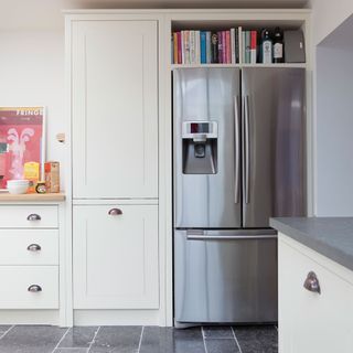 Stainless steel American-style fridge freezer in a white kitchen