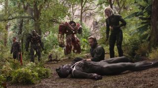 Surviving Avengers near Vision's body in Avengers: Infinity War ending