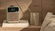 Ruark R1 Mk4 radio in Pistachio Green on a pile of books