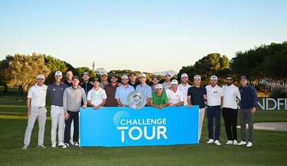 20 golfers line up behind a Challenge Tour leaderboard