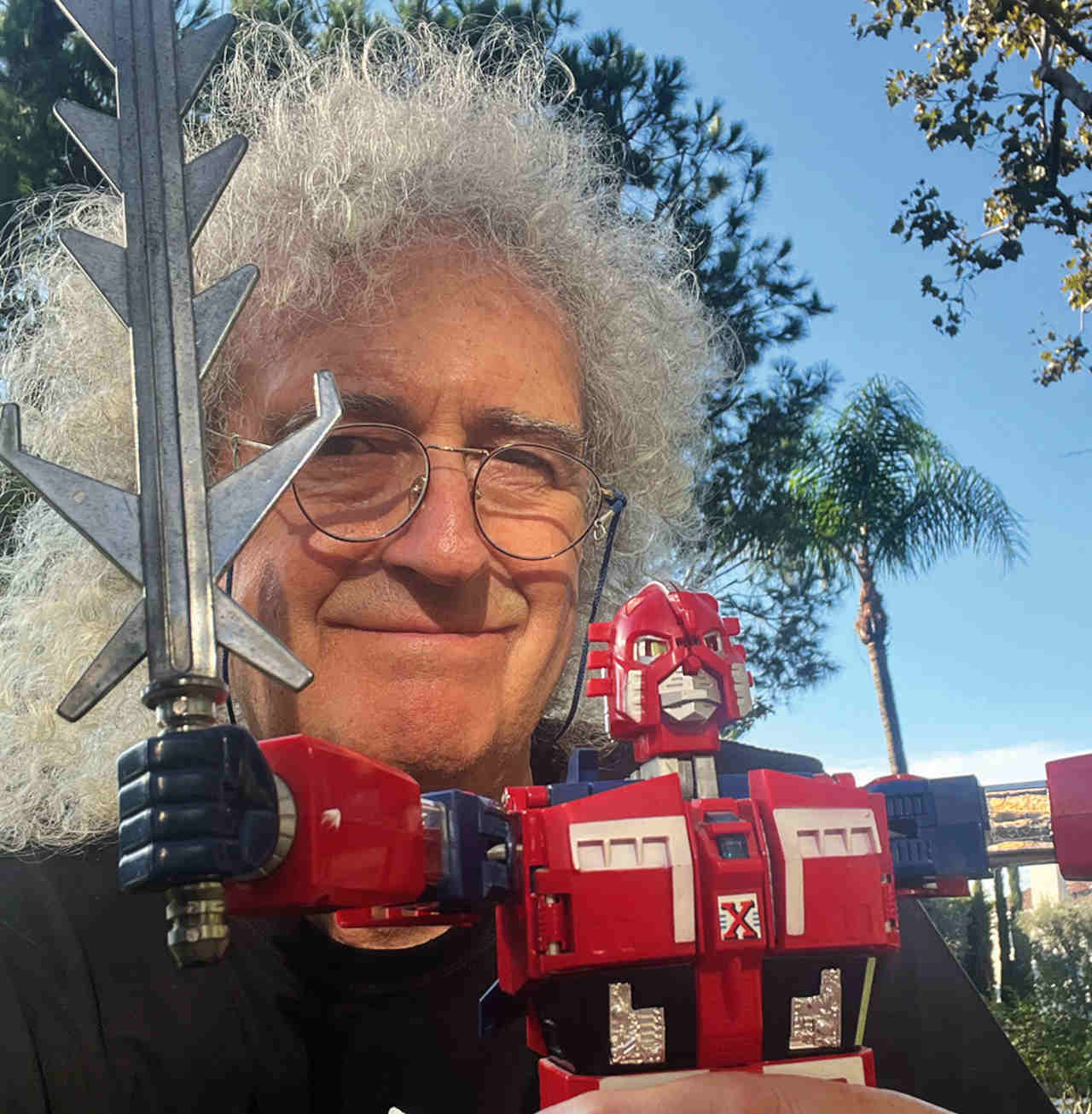 Brian May with a vintage Star Fleet toy