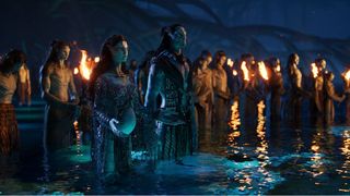 A group of Na'vi tribe members standing together in a lake