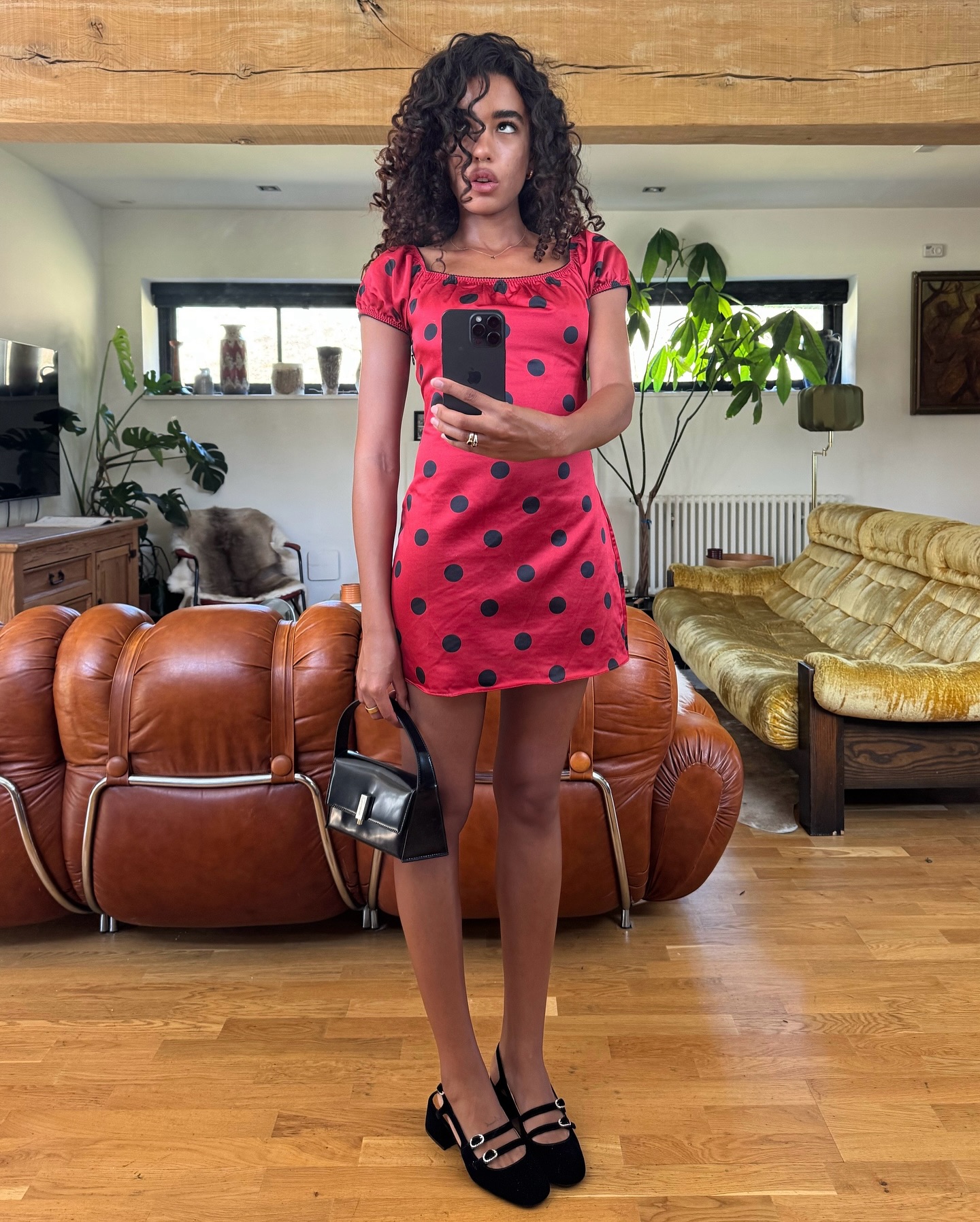 An image of @iwanacristal wearing a polka dot Realisation Par dress, an Australian fashion brand to know.