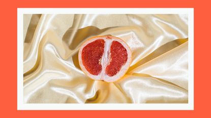 Can your clitoris shrink from lack of sex? Pictured: Fresh grapefruit on beige soft silk fabric background. Sex concept. Women's health, sexuality, erotic tension. Female vagina and clitoris symbol.