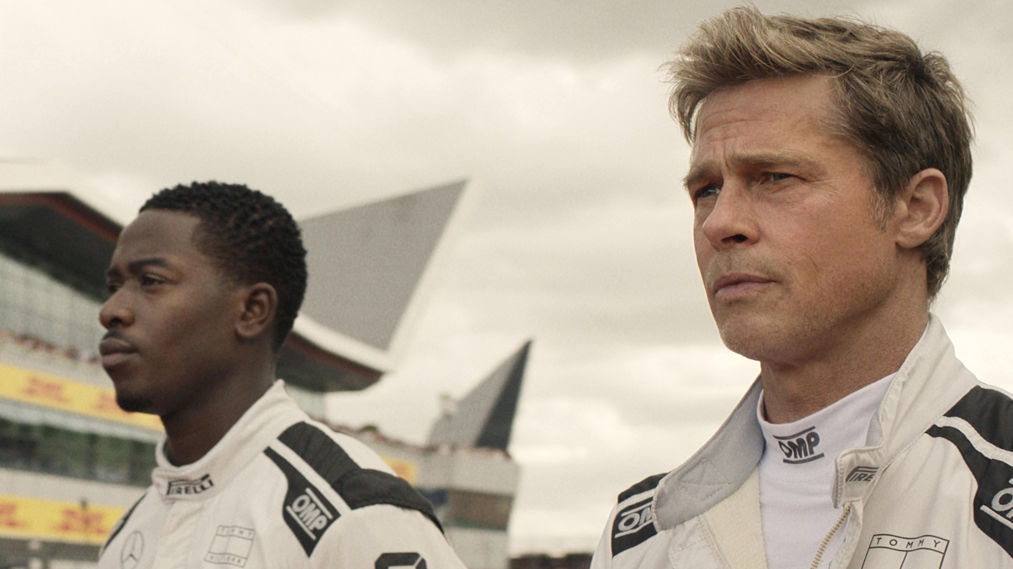 A press image from F1: the movie showing Brad Pitt and Damson Idris in their racing suits