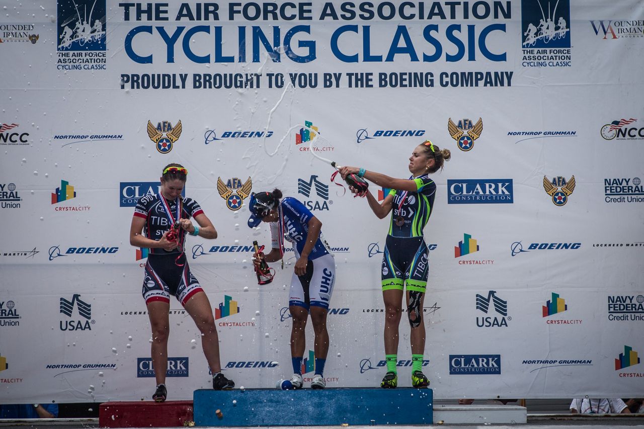 Emily Collins (TIBCO) gives Coryn Rivera (UnitedHealthcare) a good soaking with champagne