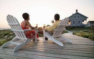 picture of couple sitting outside of vacation home