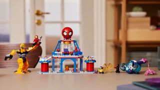 A fully-built Lego Marvel Team Spidey Web Spinner Headquarters on top of a desk