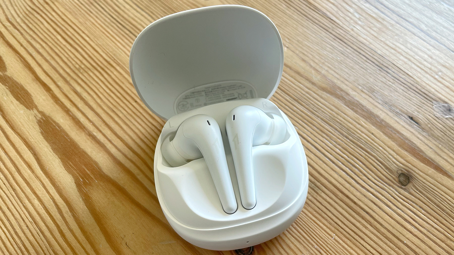 The 1More Aero true wireless earbuds in their charging case