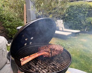 Weber Smokey Joe cooking Tomahawk