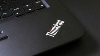 A closeup of the ThinkPad logo on a Lenovo laptop.