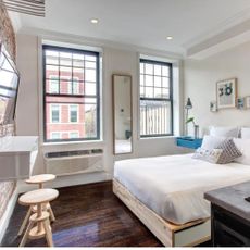 New York city apartment with fresh bed, TV and wood floors