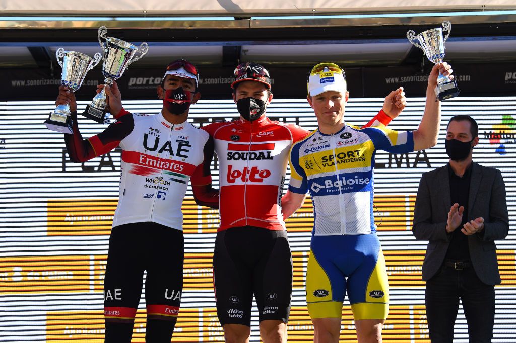 PALMA SPAIN JANUARY 30 LR Juan Sebastian Molano Benavides of Colombia and UAE Team on second place race winner Arnaud De Lie of Belgium and Team Lotto Soudal and Sasha Weemaes of Belgium and Team Sport Vlaanderen Baloise on third place pose on the podium ceremony after the 1st Challenge Ciclista Mallorca 2022 Trofeo Playa De PalmaPalma a 1691km race from Playa de Palma to Palma ChallengeMallorca on January 30 2022 in Palma Spain Photo by Dario BelingheriGetty Images