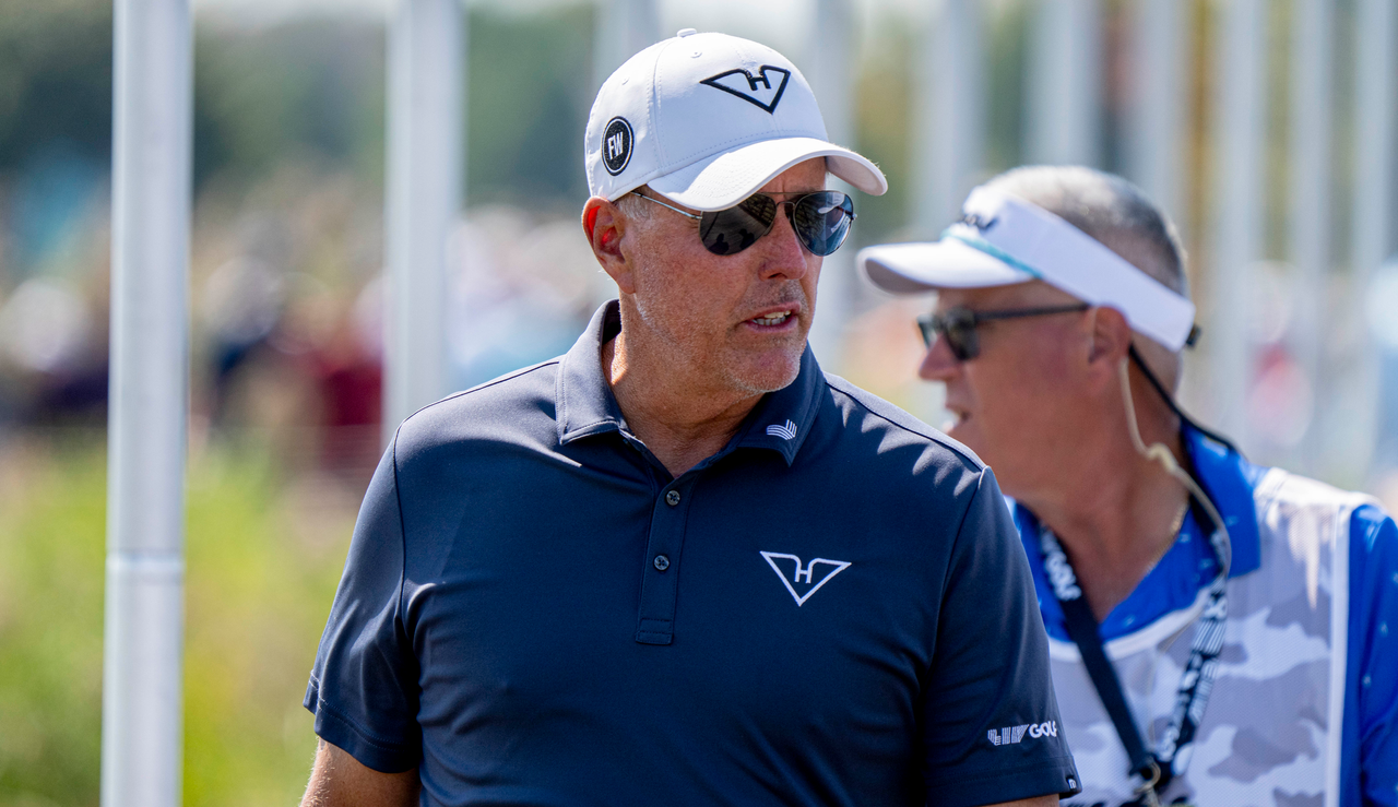 Phil Mickelson looks on whilst on the putting green