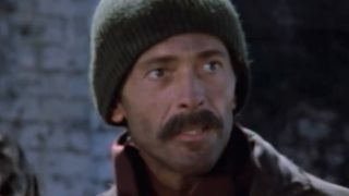 Bruce Weitz wearing a stocking cap in Hill Street Blues