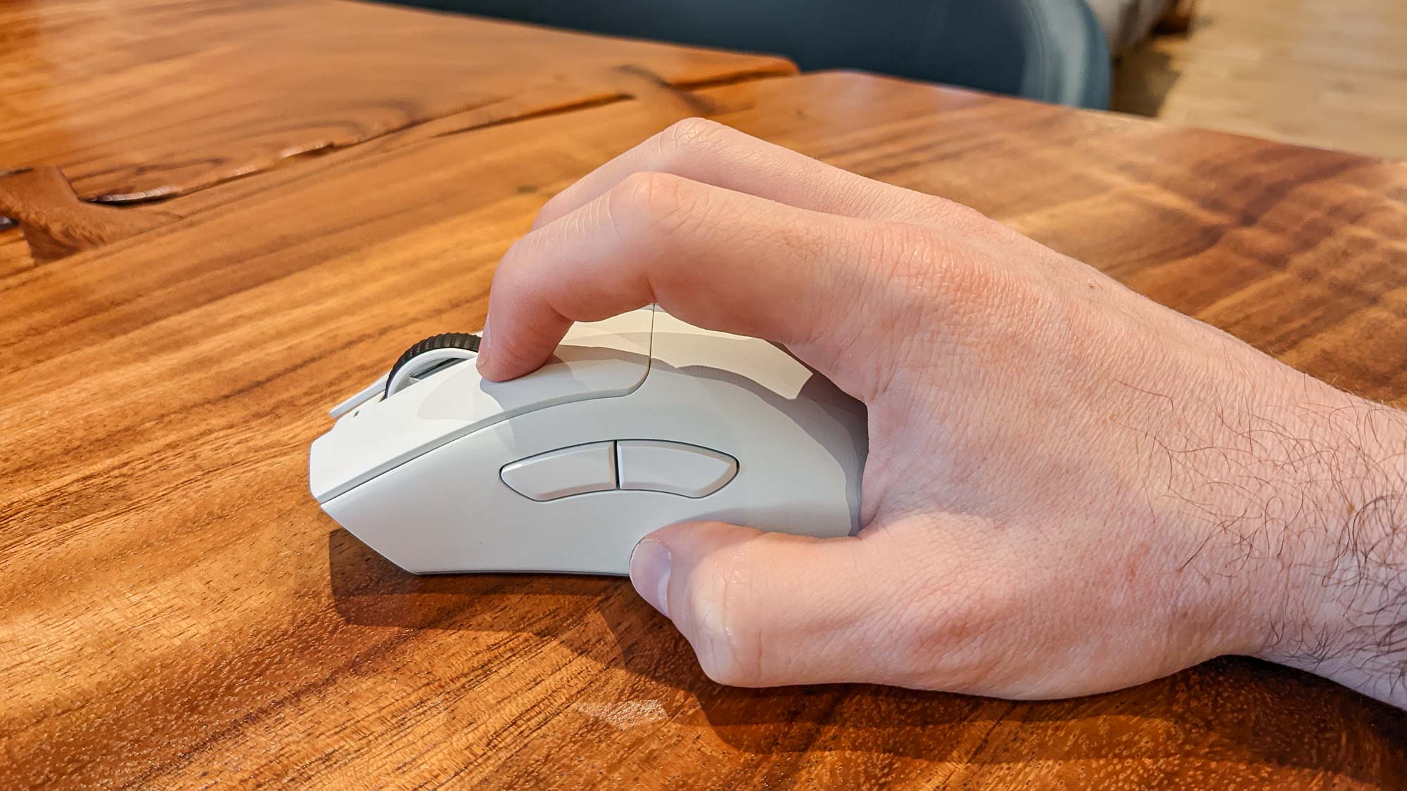 A man holding a Razer DeathAdder V3 Pro