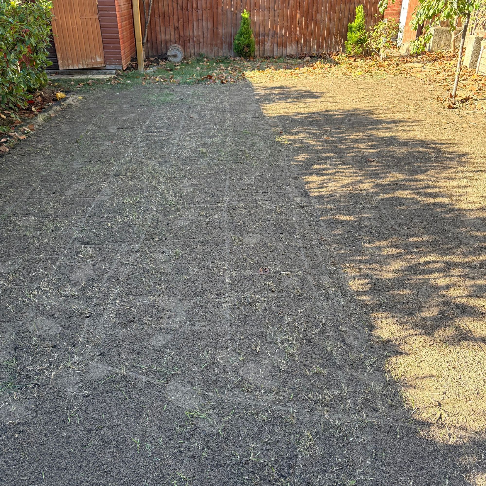 Lawn with fresh layer of lawn seeding soil