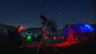 An amateur astronomer at a star party in Herefordshire