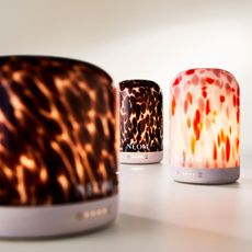 three of the neom wellbeing electric diffusers