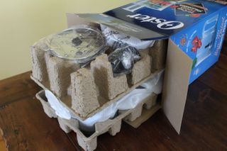 Unboxing the Oster 10-Cup Food Processor with cardboard packaging