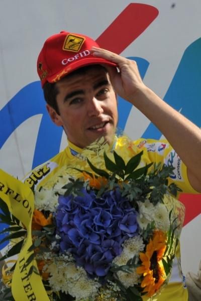 Tony Gallopin is sponsor-correct on the podium.