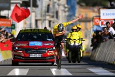 Tadej Pogačar takes a victory bow at Paris-Nice