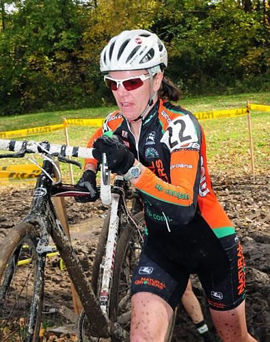 Lisa Strong (Natural Grocers) through some mud.