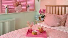 Pink and green bedroom with pink accents