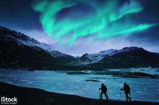 'Hikers under the Northern Lights' by powerofforever