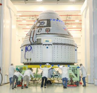 A Boeing CST-100 Starliner capsule is prepared for a critical launch abort system test at White Sands Missile Range in New Mexico. The Nov. 4, 2019 test will demonstrate a critical safety system for crewed launches.