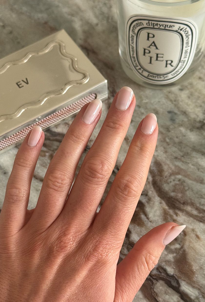 A close up of Eleanor's nails, painted with two coats of OPI Funny Bunny and OPI Baby, Take A Vow nail polish