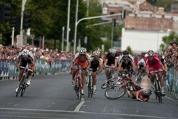 Jonathan Cantwell (far right) powers to the line as Joel Pearson continues his wrestle with the bitumen as riders charge to the finish.