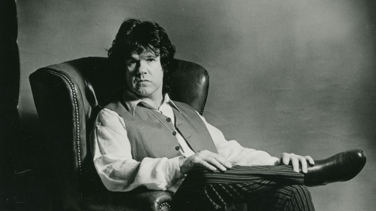 Gary Moore relaxing in an armchair