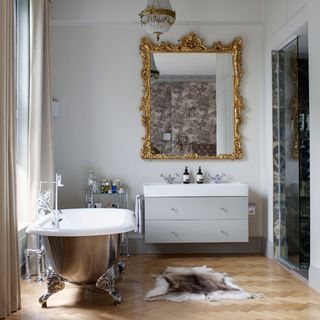 grand bathroom with wooden flooring