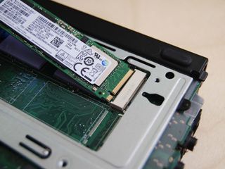 Pull the M.2 SSD out of the slot.