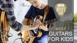 Man shows child how to play something on an electric guitar