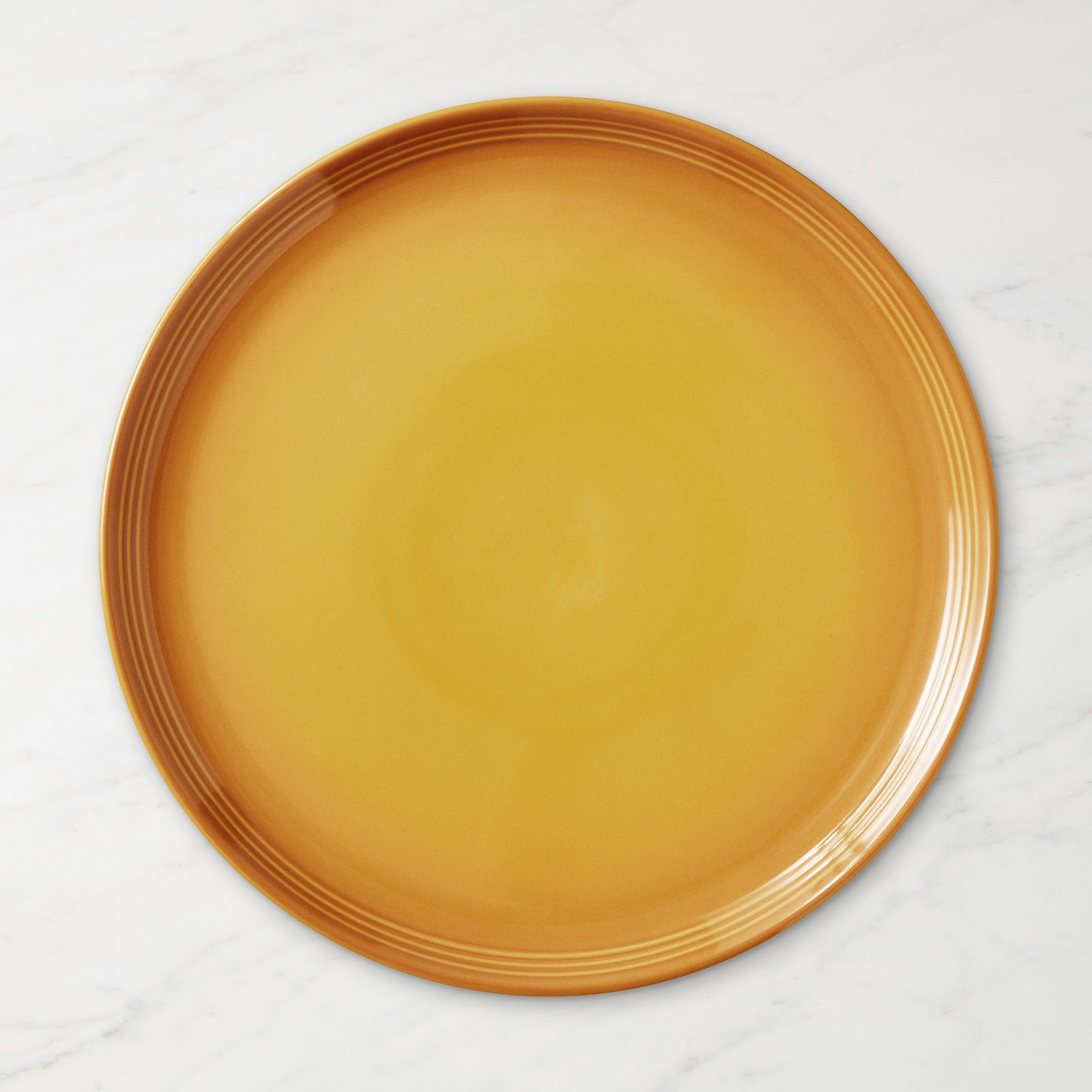 Burnt yellow Le Creuset plate