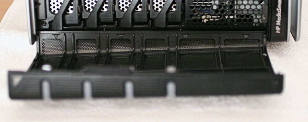Side view of front door hinge, pivots attach at top and bottom