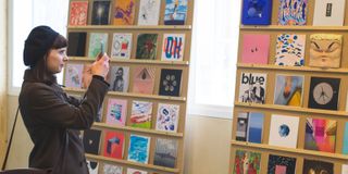 Girl looking at record sleeves