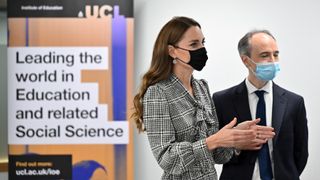 Britain's Catherine, Duchess of Cambridge (L) talks with Professor Pasco Fearon during a visit to University College London's Centre for Longitudinal Studies in London on October 5, 2021, Kate Middleton special project